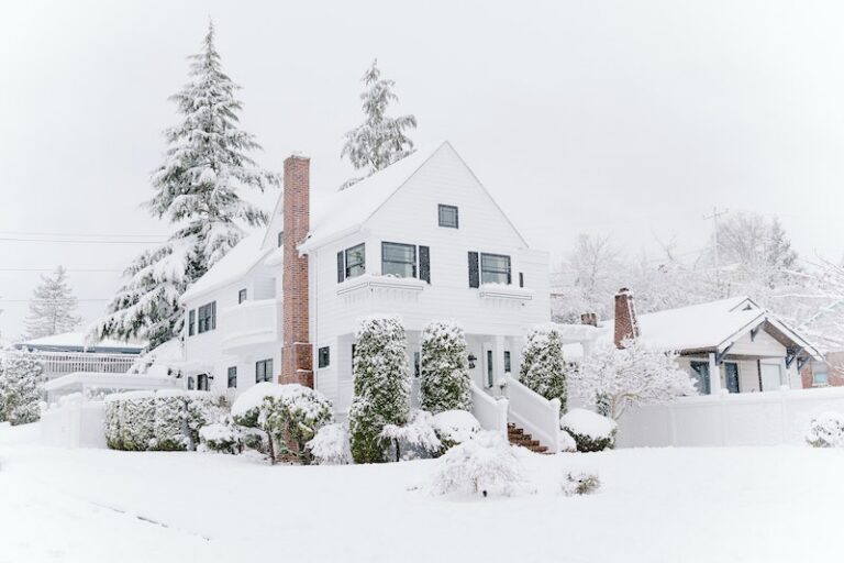 exterior of a white house in winter